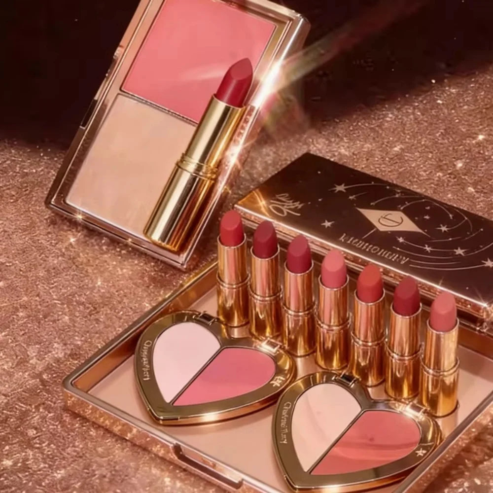 Charlotte Tilbury lipstick set with matte lip colors and heart-shaped blush palettes in luxury gold packaging.