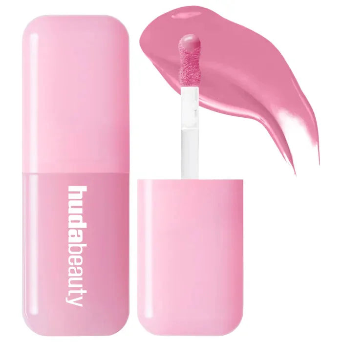 Huda Beauty hydrating lip and cheek tint stick in soft pink with creamy, smooth applicator swatch.