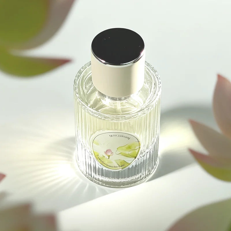 Fresh Lotus floral woody women’s perfume in a ribbed glass bottle with lotus and jasmine notes. Long-lasting scent.