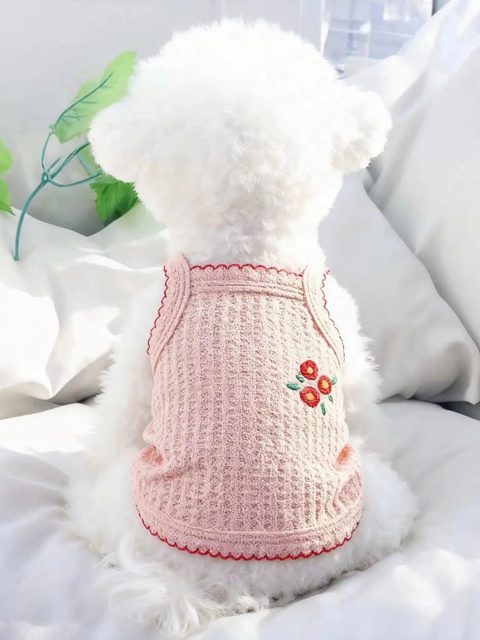 Soft pink, breathable summer tank top for small dogs like Bichons, featuring delicate floral embroidery and trim.