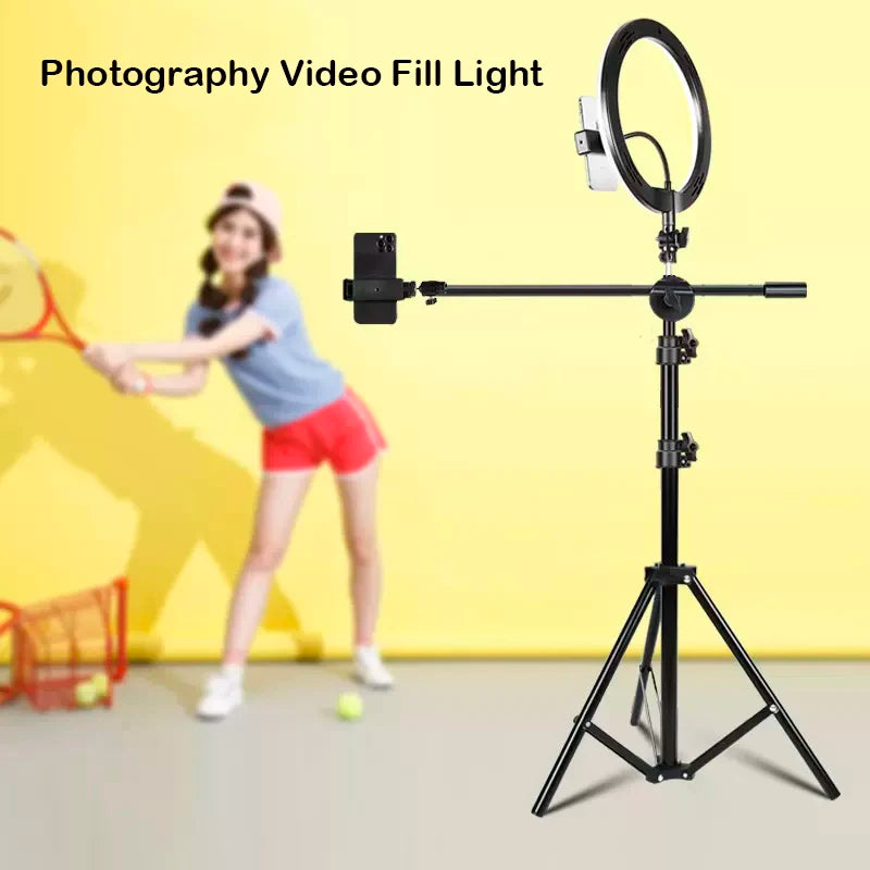 Black tripod stand with a ring light and adjustable phone holder mount for filming and photography.