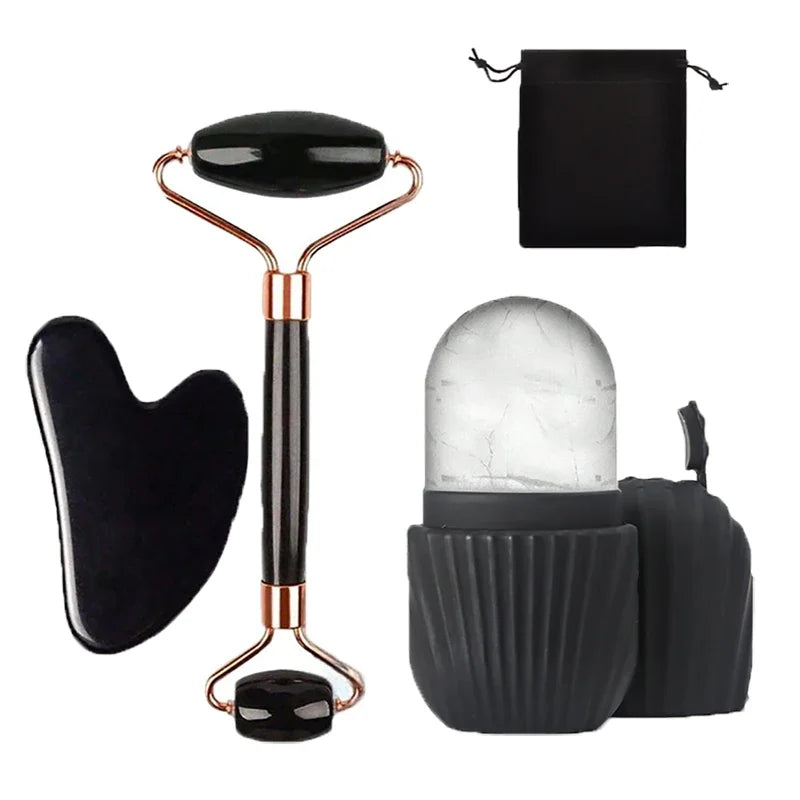 Skincare set: a black jade facial roller, a heart-shaped gua sha tool, a silicone ice roller, and a storage pouch.