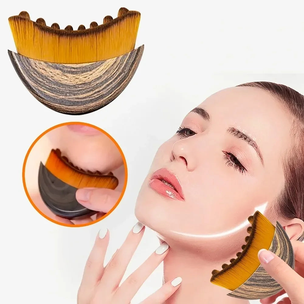 Curved face contouring brush with yellow bristles and a wood-grain handle, shown in use on a jawline for massage.