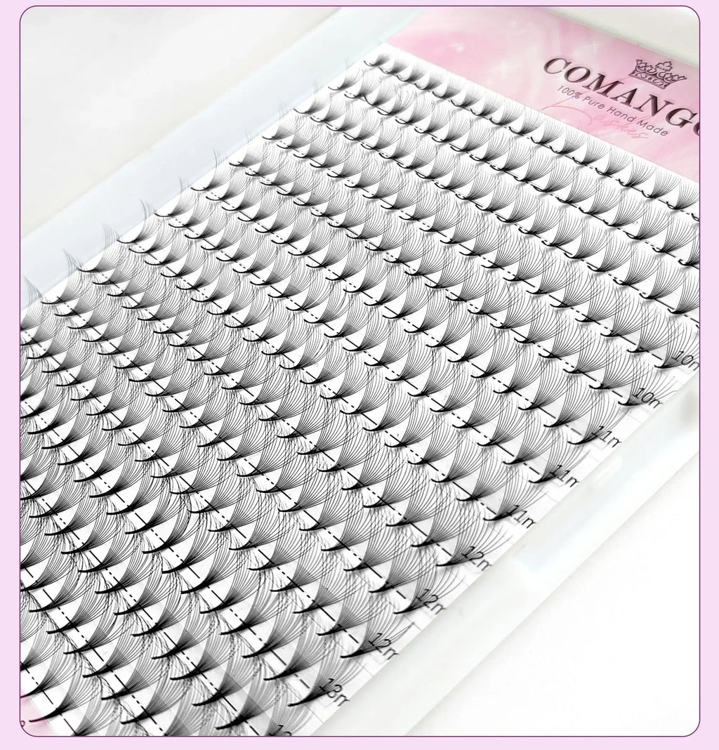 Tray of black, pre-made volume eyelash fan extensions in varied lengths for professional cosmetic application.