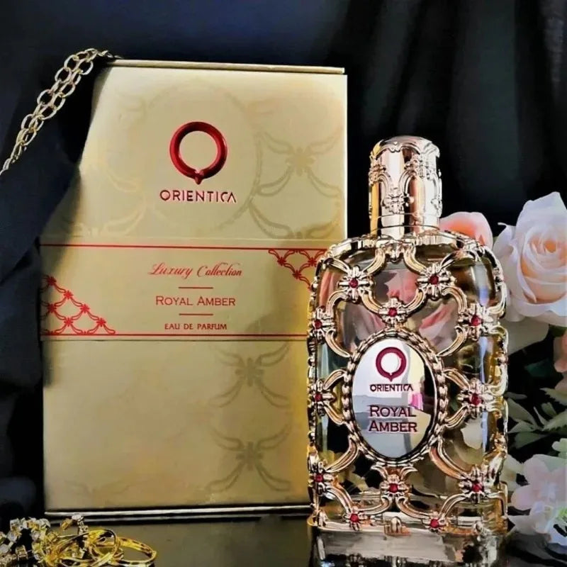 Orientica Royal Amber EDP 100ml: A luxurious, sweet, warm unisex perfume in a gold-filigree ornamental glass bottle.