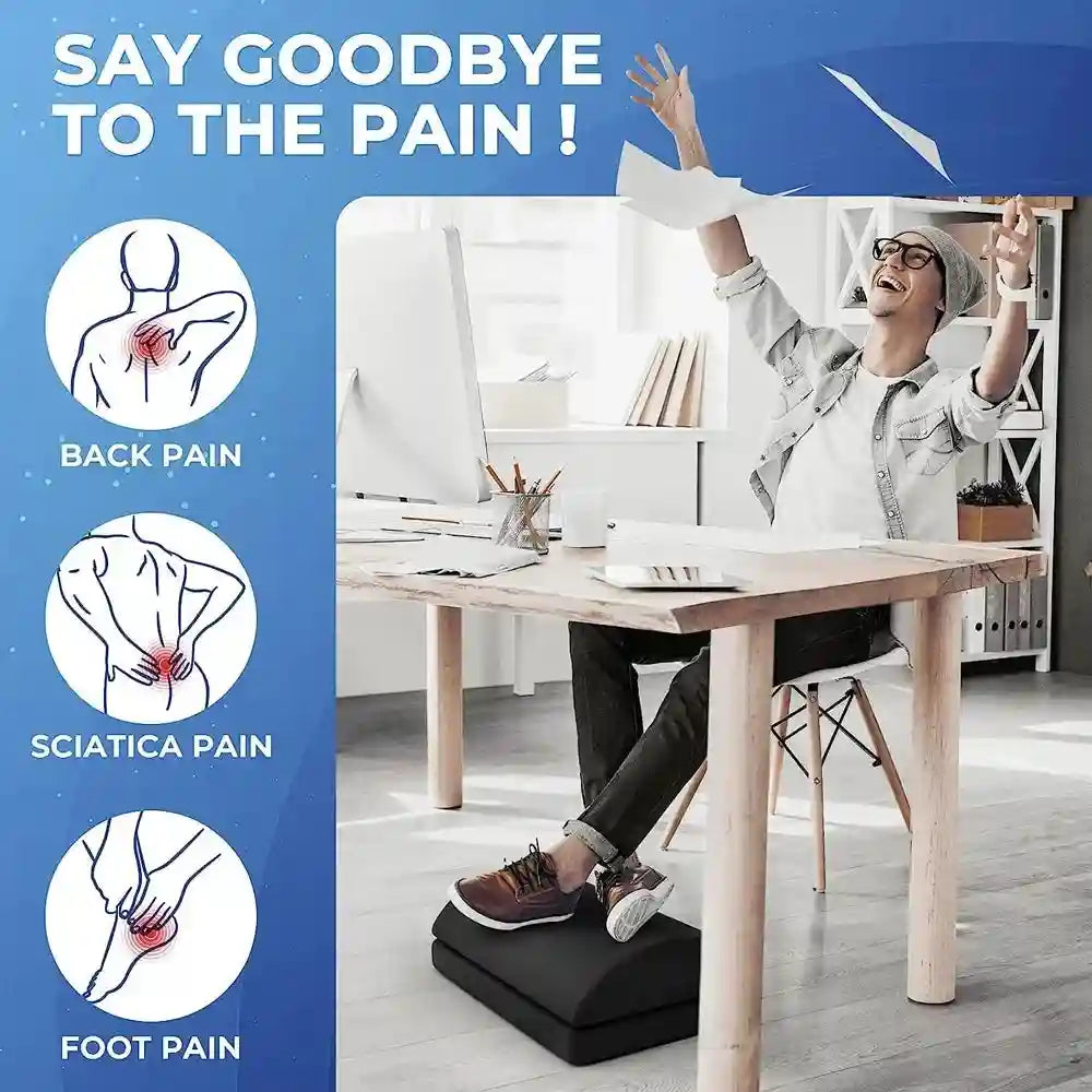 Adjustable memory foam under desk foot rest for office back, hip, and foot pain relief in a modern home workspace.