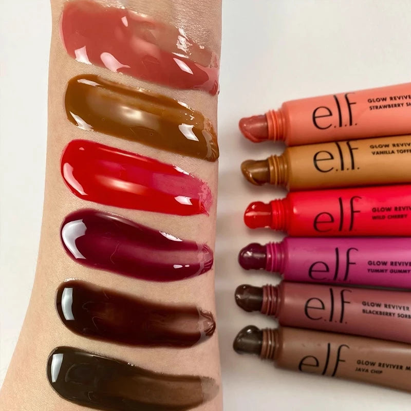 e.l.f. Glow Reviver Lip Oil swatches in various glossy shades on arm, showing sheer, pigmented, high-shine texture.