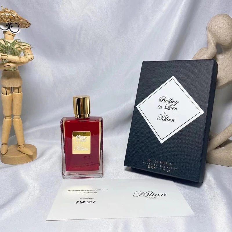 Kilian Rolling in Love unisex EDP 50ml. Red rectangular niche fragrance bottle, warm spicy floral scent, luxury perfume.