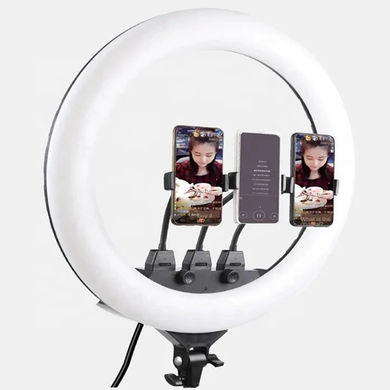 Large circular white LED ring light with three flexible mounts for holding smartphones, used for video recording.