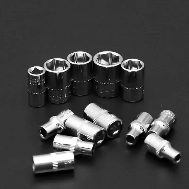 Chrome socket set with short extensions arranged on a black surface