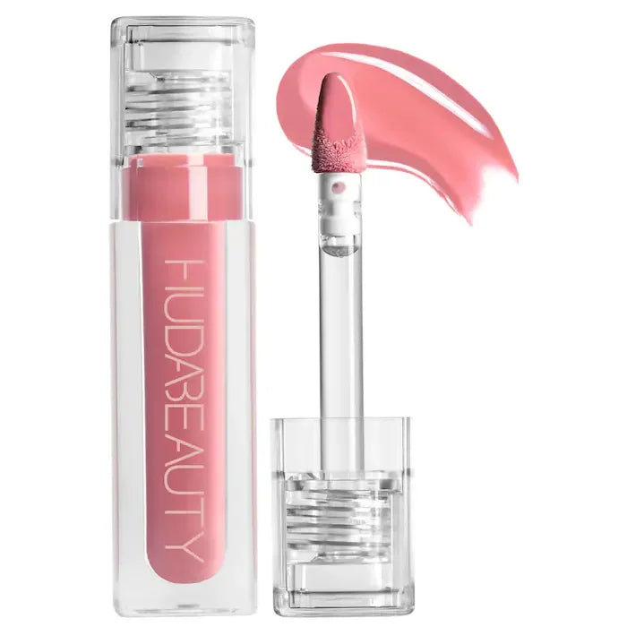 Huda Beauty hydrating lip and cheek tint in a pink, creamy formula with a clear applicator wand and tube.