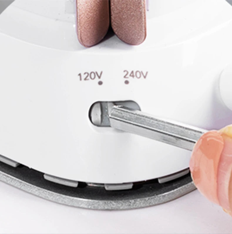 Tidesmit mini handheld travel iron showing compact soleplate design for precision ironing during home or travel use.