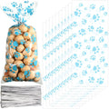 Blue paw print cellophane bags with ties for pet party favors and treat storage. Heat-sealable gift bags for dog birthdays.
