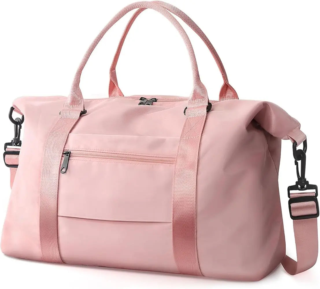 Large pink travel duffel bag with shoulder strap, durable fabric, zip pockets, and spacious compartment for gym or gear.
