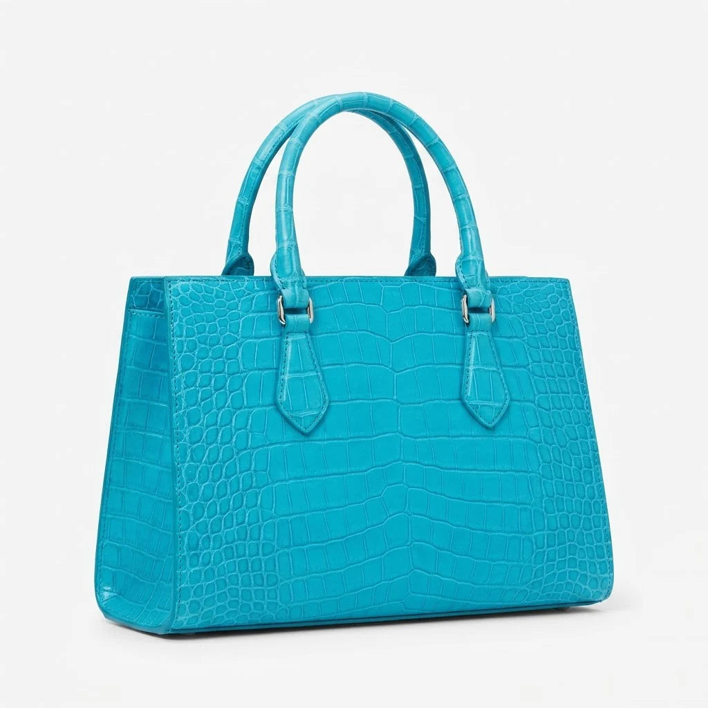 Turquoise genuine leather handbag with vintage alligator-embossed design, sturdy handles, and luxury structured style.