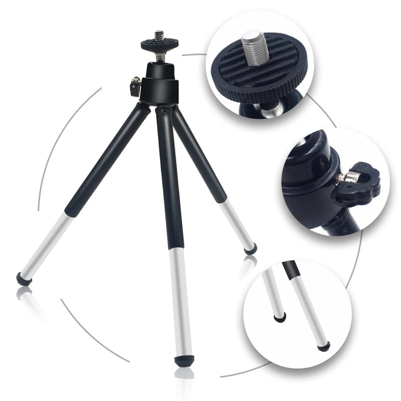 Small portable metal tripod with adjustable head and rubber-tipped legs for mounting cameras or phones.
