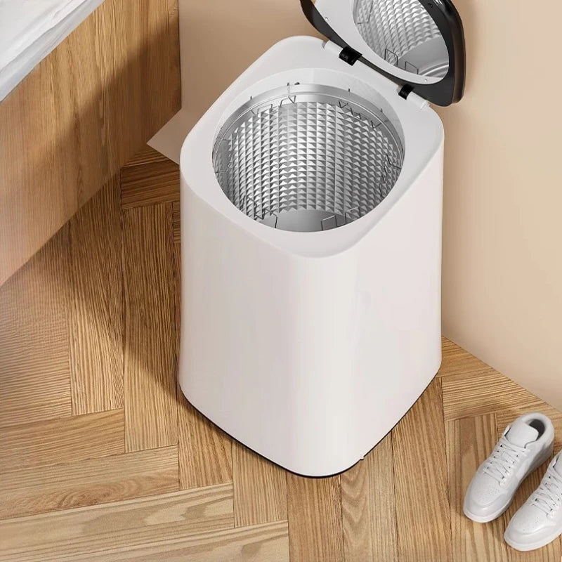 Tidesmit 60L automatic clothes dryer with baby clothing disinfection and air-drying features, side interior view
