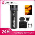 Black handheld LED photography flashlight with light filters, silicone diffuser, charging cable, and storage pouch.