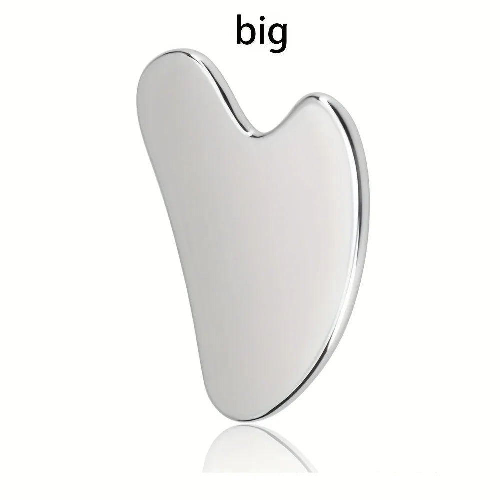 Heart-shaped stainless steel gua sha massage tool with a polished, reflective silver finish.