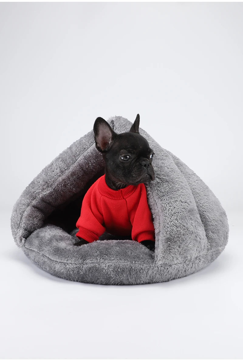 French bulldog in red sweater inside a cozy grey plush washable hooded dog bed for warm, comfortable pet relaxation.