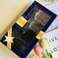 BOOS Landmark Men’s 4pc EDP Gift Set: High-end, long-lasting cologne in glass bottles with modern, sleek design.