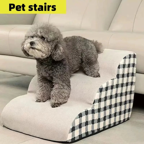 Grey dog on a non-slip memory foam pet staircase for sofa access. Washable, stable 3-step ladder for small pets.