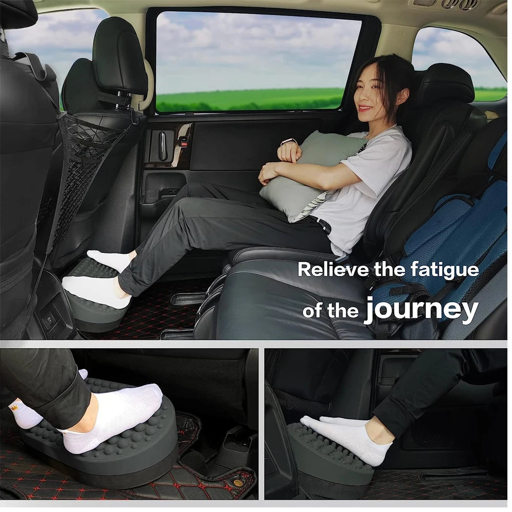 Grey silicone foot rest ottoman with massage nodes for plantar fasciitis relief in a car or under a desk.