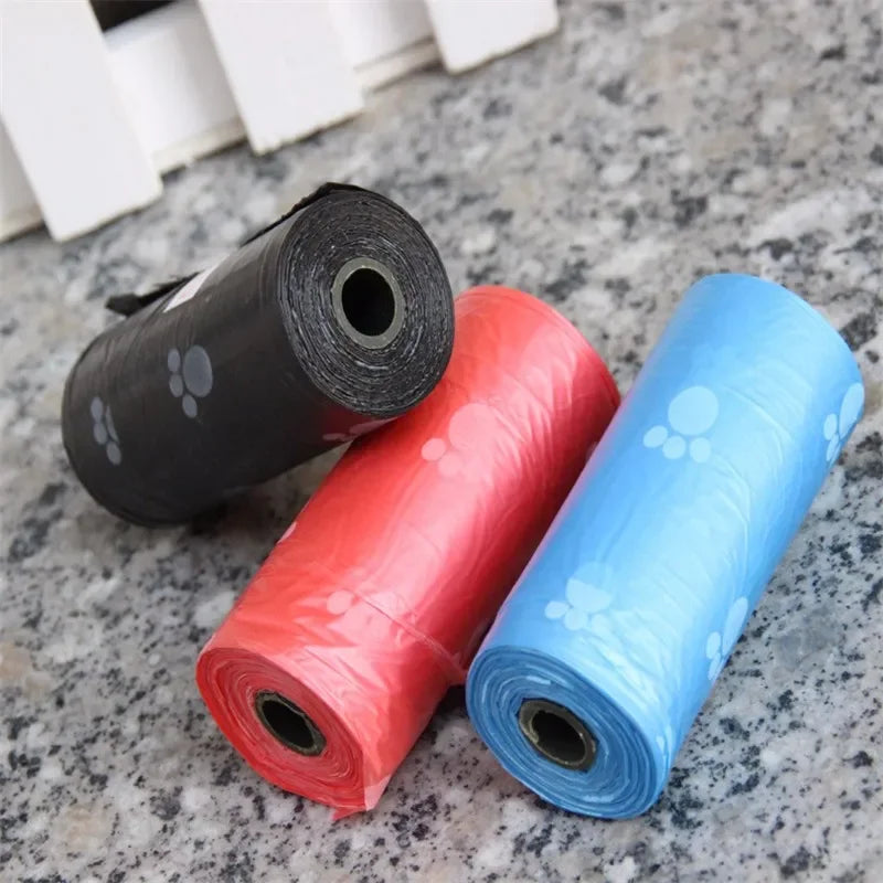 Leak-proof dog poop bags with cartoon paw print, colorful rolls for easy pet waste cleanup.