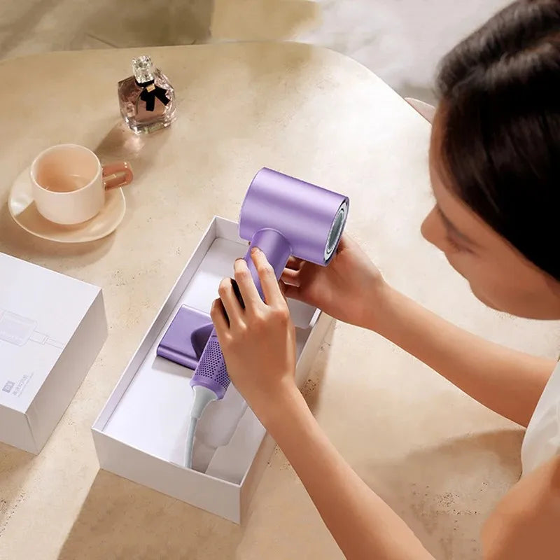 Purple high-speed ionic hair dryer with LED display and nozzle attachment, 1600W powerful professional styling tool.