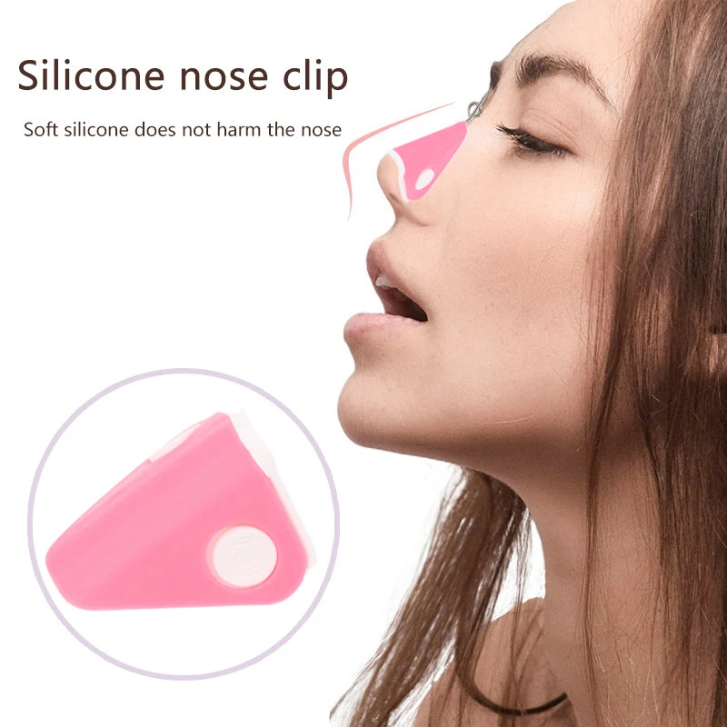 Pink silicone nose shaper lifting clip for bridge straightening and facial correction beauty tool on a woman's nose.