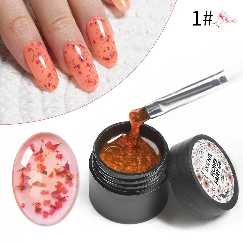 Coral-colored floral nail gel with dried flower petals in a 5ml black jar, shown with an application brush and swatches.