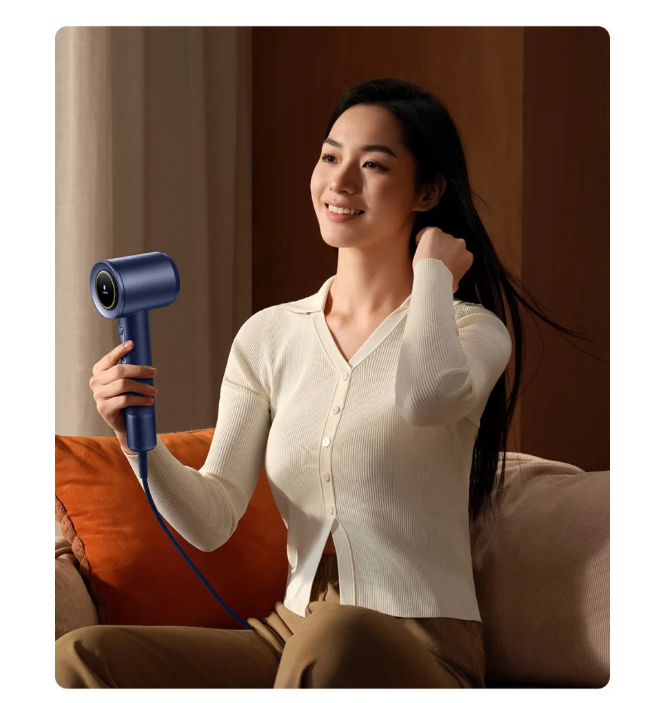 Woman using a navy blue MIJIA high-speed water ion hair dryer for fast, quiet, and smart hair drying.