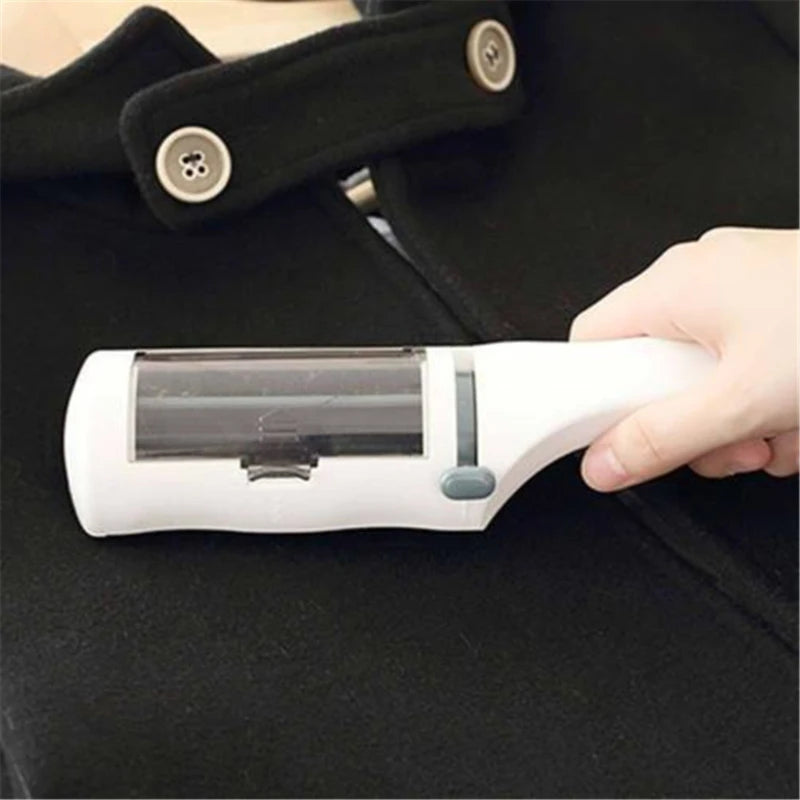 Self-cleaning white lint brush removing pet hair and dust from a black coat for easy clothing cleaning.
