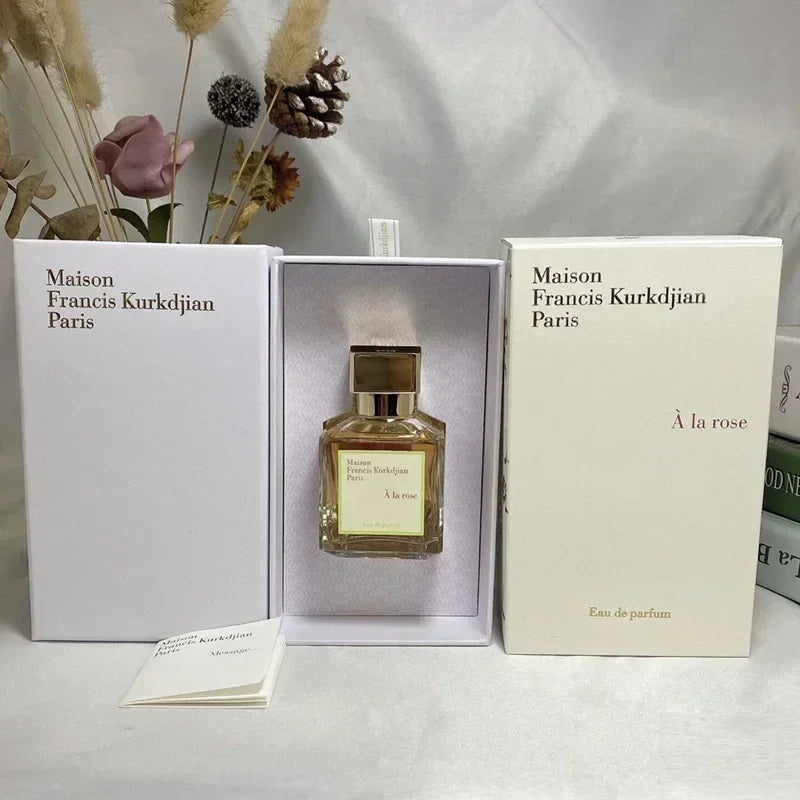 Maison Francis Kurkdjian À la rose EDP, floral rose fragrance in a square glass bottle with gold cap, luxury gift set.