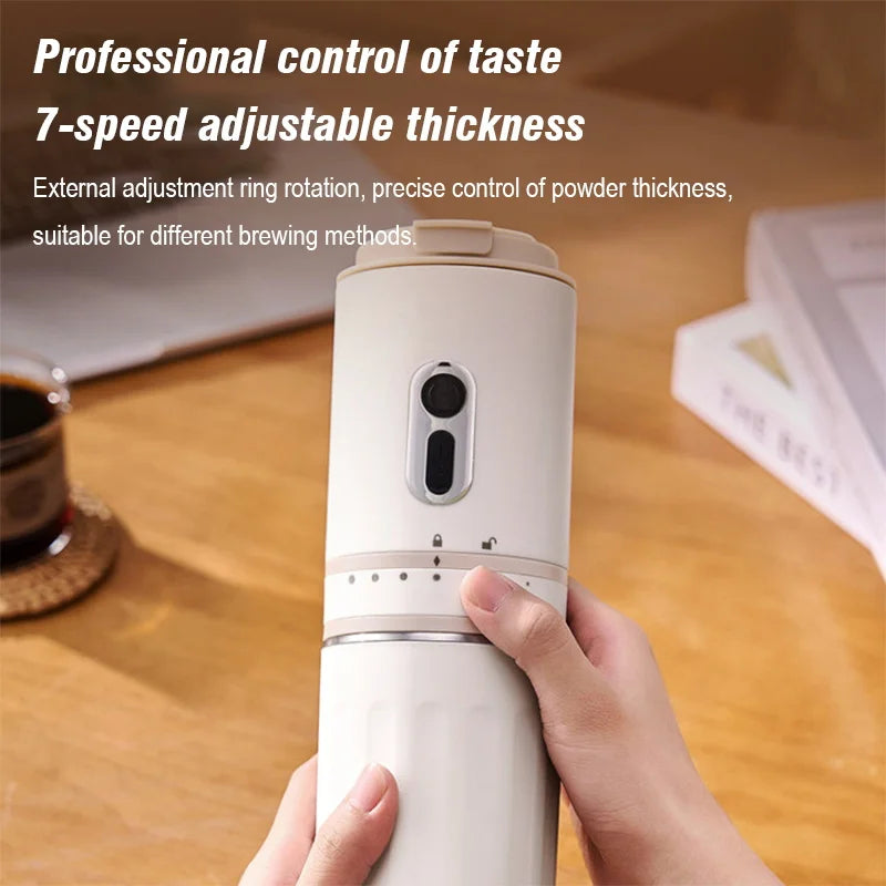 Beige handheld manual coffee grinder with 7-speed adjustable thickness dial and metallic power button.
