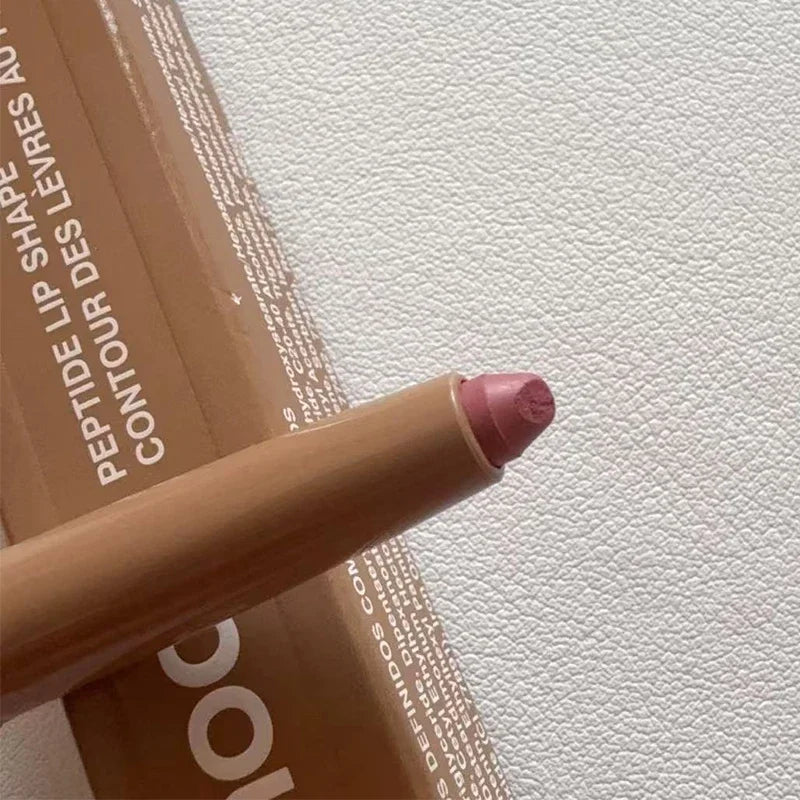 Rhode Skin Peptide Lip Shape Pen in mauve, featuring a matte finish tip and neutral-toned beige pencil packaging.