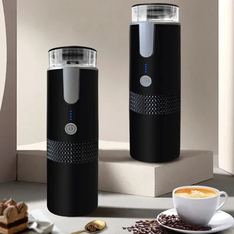 Two black portable electric coffee makers with clear tops, textured grips, power buttons, and blue LED indicators.