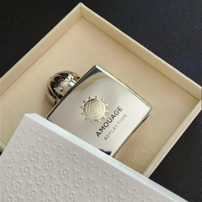 Amouage Reflection Woman 100ml EDP, floral oriental perfume in a sophisticated square metallic bottle with crown cap.