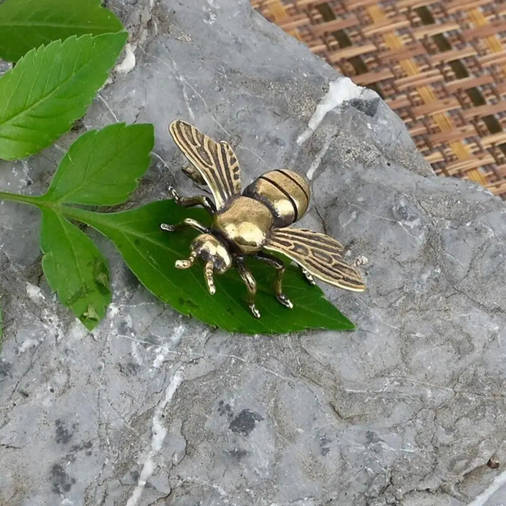 Solid brass bee figurine tea pet, a realistic golden metal insect sculpture for home desktop decor or tea ceremony.