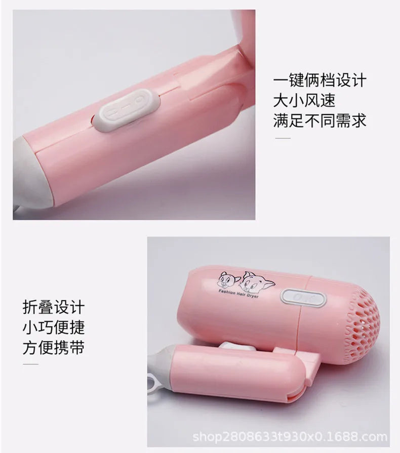 Pink foldable mini hair dryer with cartoon design, dual speed settings, and compact, travel-friendly handle.