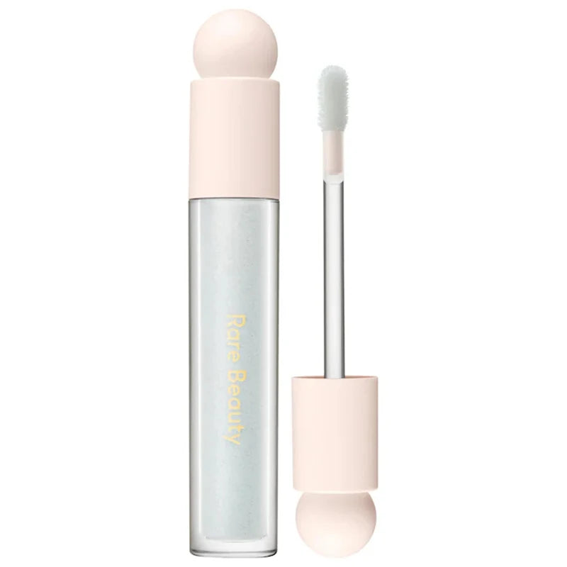 Rare Beauty Soft Pinch Tinted Lip Oil with doe-foot applicator in clear, moisturizing glossy tube packaging.