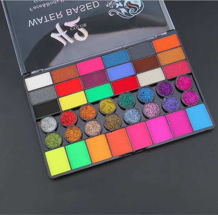 Tidesmit 42 color face and body paint kit texture close-up showing neon water soluble makeup pigments