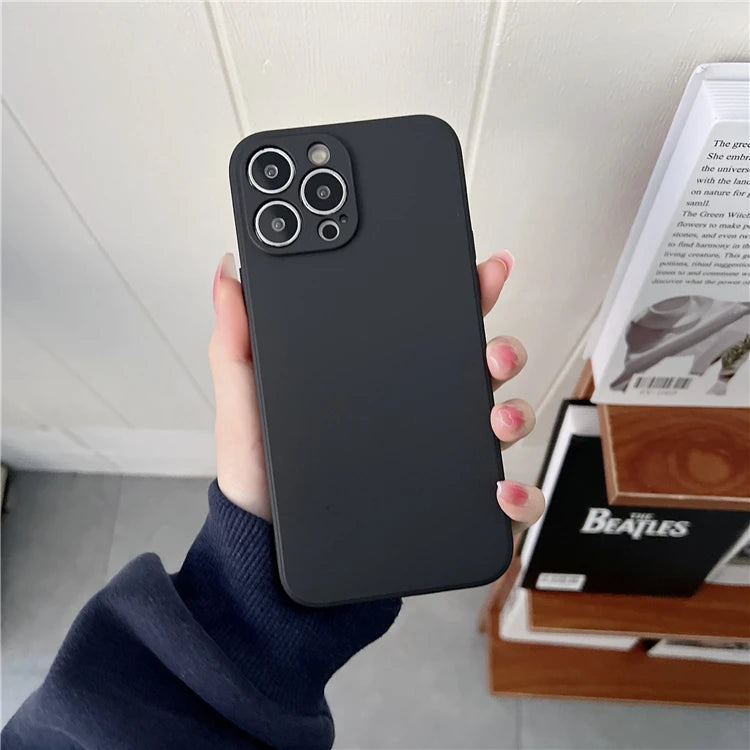 Matte black silicone phone case with a camera lens protector for a triple-camera smartphone.