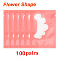 Flower-shaped white lint-free eye patches in pink individual gel sticker sachets for eyelash extension application.