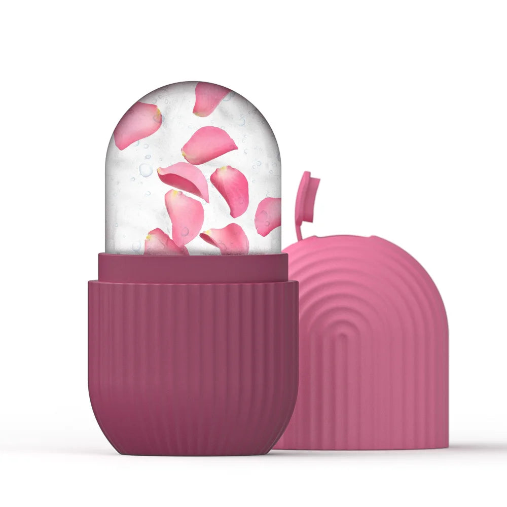 A pink silicone ice roller mold filled with frozen ice and floating rose petals, shown with its matching lid.