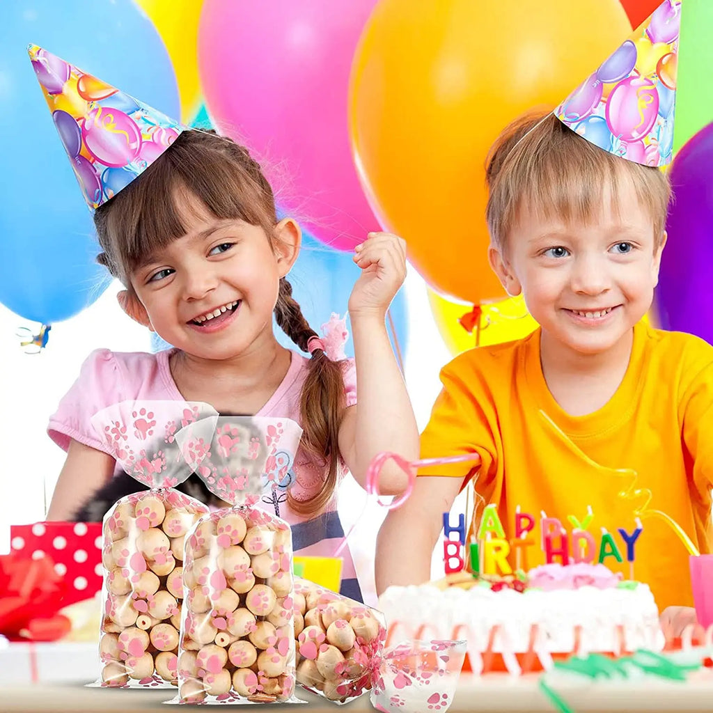 Clear cellophane bags with pink paw prints, perfect for dog-themed pet birthday party favors and treat storage.