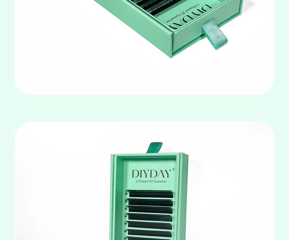 DIYDAY black U-shaped faux mink eyelash extension strips in a mint green sliding drawer storage box.