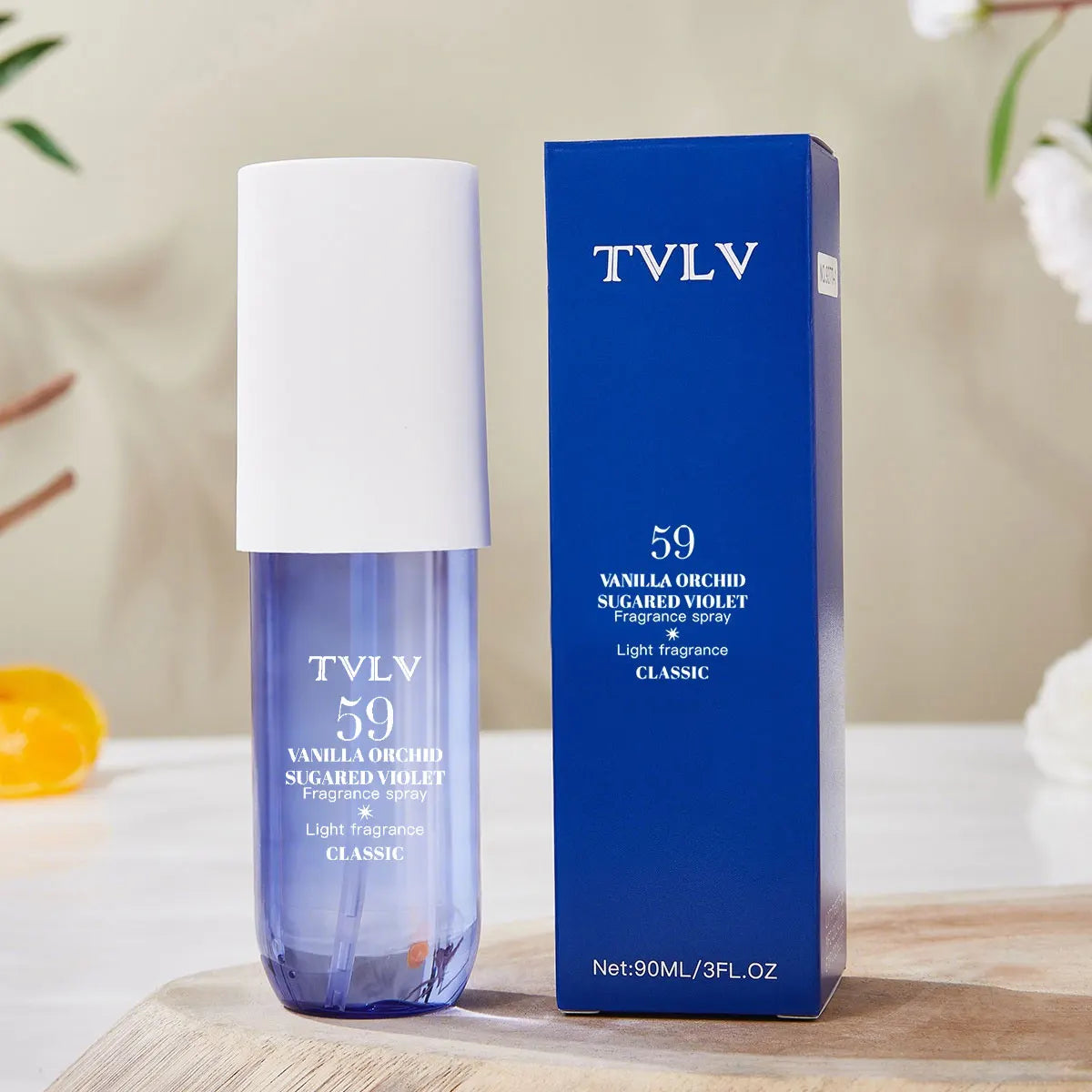 TVLV 59 Vanilla Orchid Sugared Violet long-lasting alcohol-free perfume spray. Blue cylindrical bottle, elegant design.