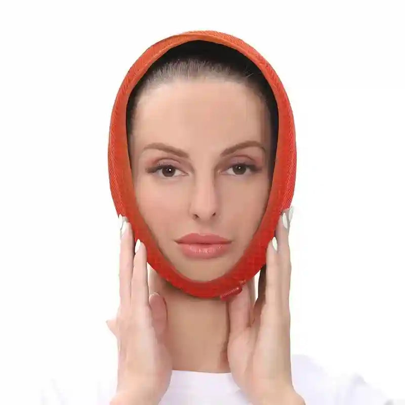 A woman wearing an orange, mesh-textured adjustable wrap around her jawline and chin for facial support.