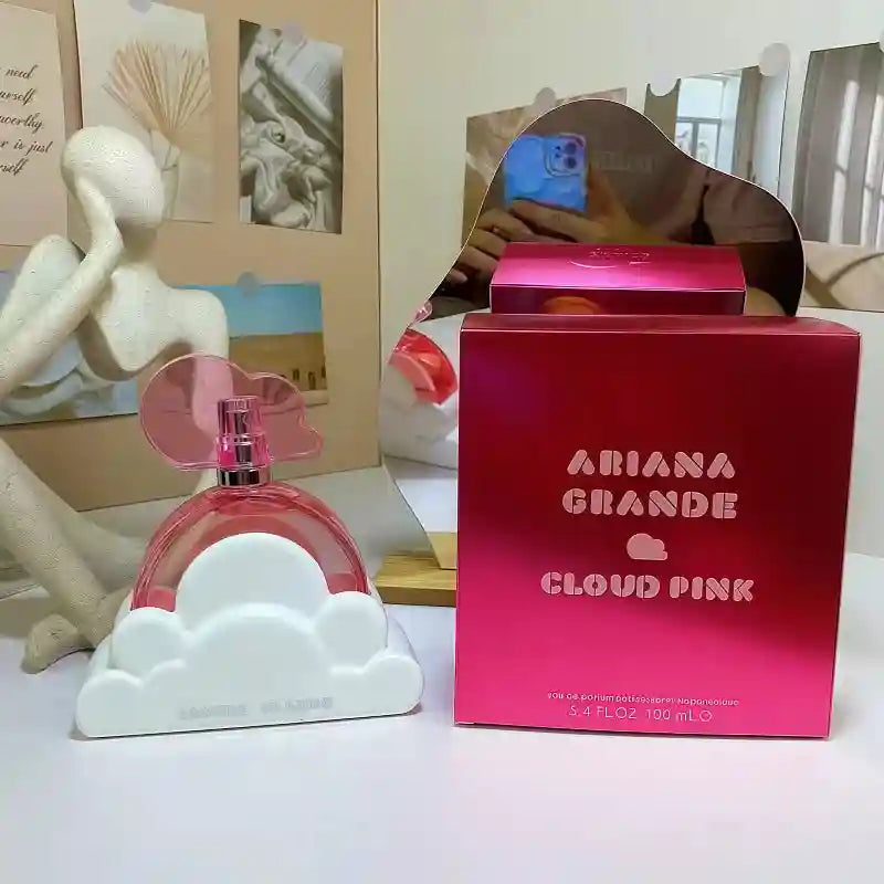 Ariana Grande Cloud Pink EDP: 100ml women’s fragrance in a signature pink cloud bottle with white base. Long-lasting.